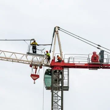 Erecting a Tower Crane. Stock Photos