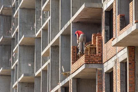 Erection of internal partitions and external walls of a monolithic frame Stock Photos