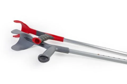 Ergonomic plastic handles of two different metal elbow crutches Stock Photos