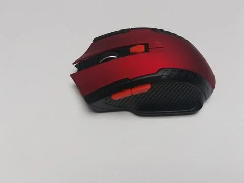 Ergonomic Red Wireless Computer Mouse Side View on White 库存照片