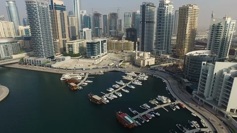 Erial drone view of Dubai marina harbor with boat yacht Stock Footage 100867593