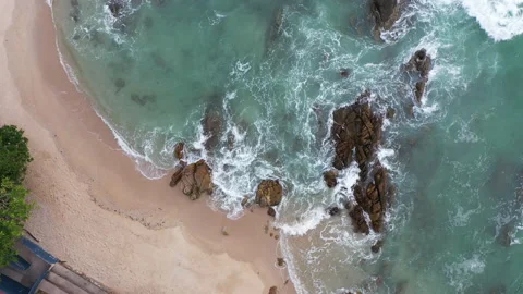 Erial top view Wave after wave swept towards the shore. Video stock 157982983