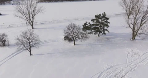 Erial View of an Off-Road Vehicle Drifting Through a Snowy Landscape Stock Footage 301579891