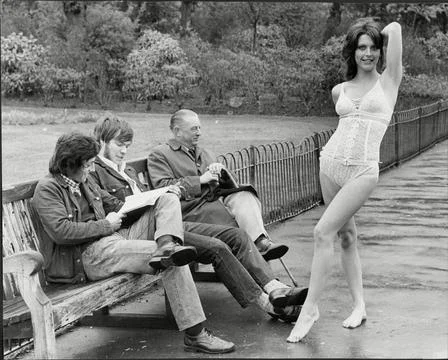 Eric Creer Model & Actress In Underwear Posing In Park By Men On Bench 1971. Stock Photos