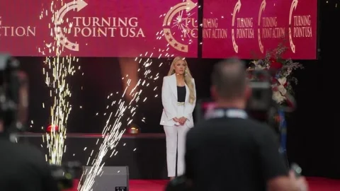 Erika Kirk on stage as pyrotechnics fire at the Charlie Kirk memorial service Stock Footage 345298507