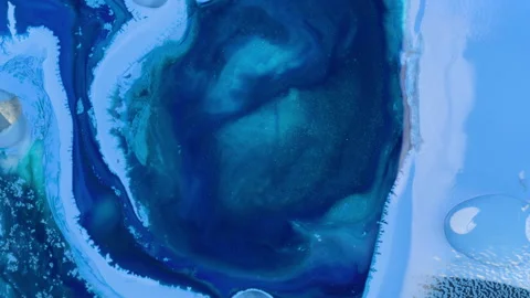 Erode degradation of dark thick blue ink pattern swirling in ocean Video stock 269032419