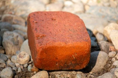 An eroded brick in the sun 库存照片