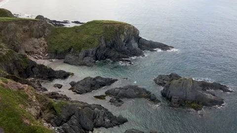 Eroded Cliffs, Rocky Shore &amp; Blue Crystal Clear Ocean - Aerial Drone Footage Stock Footage 160101686