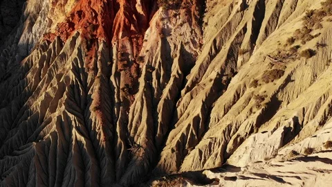 Eroded Desert Hill Side at Sunset - Drone Aerial Stock Footage 111388936