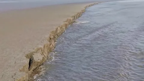 Eroded Earth Bank with Intricate Patterns by Powerful Tidal Water Qiantang Stock Footage 339593424