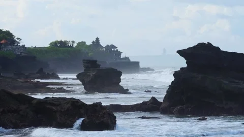 Eroded Geological Structure Overlooking Tranquil Ocean And Shrine 스톡 동영상 337433372