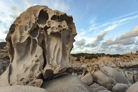 Eroded granite rock formation under cloudy sky in punta molentis, sardinia,.. 스톡 사진