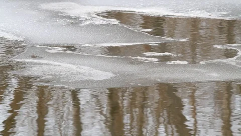 Eroded ice on the spring river Stock Footage 128945840