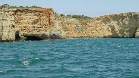 Eroded Limestone Cliffs and Sea Caves – Clear Blue Water Shoreline Stock Footage 309810214