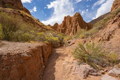 Eroded mountain landscape with sandstone cliffs, canyon with red and orange Stock Photos