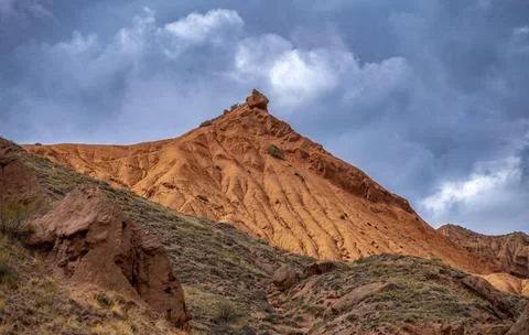 Eroded mountain landscape with sandstone cliffs, canyon with red and orange 스톡 사진