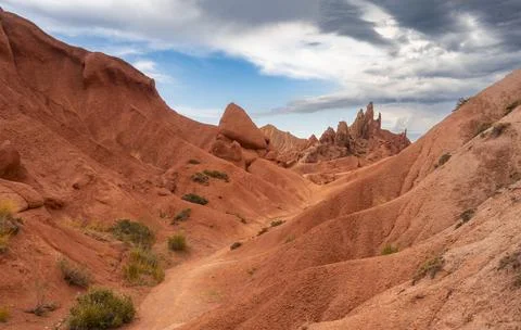 Eroded mountain landscape, sandstone cliffs, canyon with red and orange rock 스톡 사진