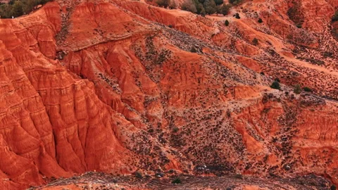 Eroded red clay hillside with layered sediment, Spain. Close up texture of Stock Footage 336385156