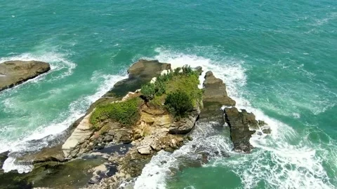 Eroded rock washed by ocean waves on Klayar beach, East Java, Indonesia, Stock Footage 166497375