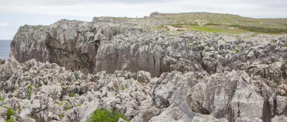 Eroded rocks formations on the edge of the cliffs of Bufones de Pria, Llame.. Stock Photos