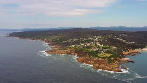 Eroded rocks of Tathra headland cape coast on Sapphire coast – aerial 4k. Stock Footage 196806027