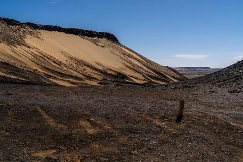Eroded Sand Slope and Basalt Ridge in Giza, Egypt Stock Photos