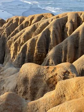 Eroded Sandstone Bluffs and Rounded Runnels Overlooking the Ocean in Carlsbad Stock Photos