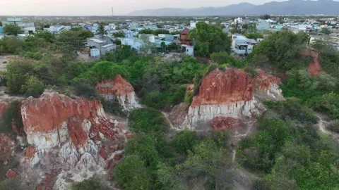 Eroded by sea waves red bazalt cliffs Stock Footage 239078841