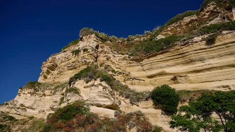 Eroding Cliff Face Dominating the Coastline of Tropea, Calabria, Italy Stock Photos