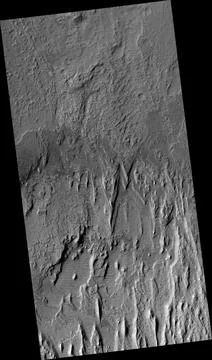 Eroding Layers in an Impact Crater Foto stock