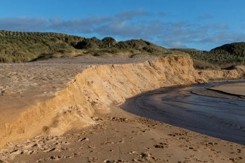 Eroding sand bank at the beach Foto stock