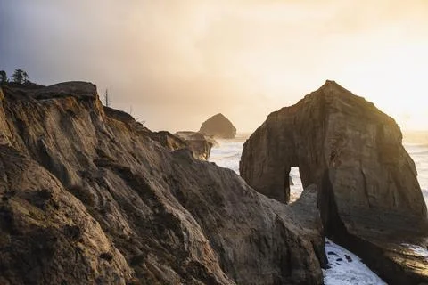Eroding shoreline at sunset in coastal Oregon Stock Photos