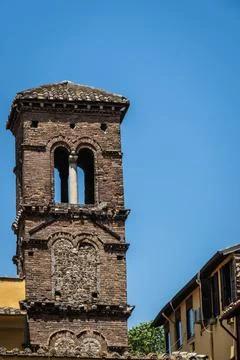 The eroding stonework of an old church bell tower in Rome Photos