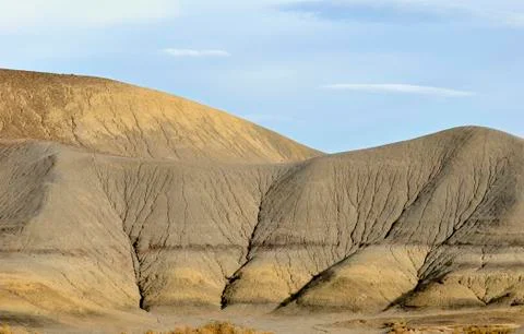 Eroding yellowish-gray sandstone formation, structured through traces of flow Foto stock