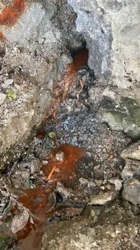 Erosion path with rusty water Stock Photos