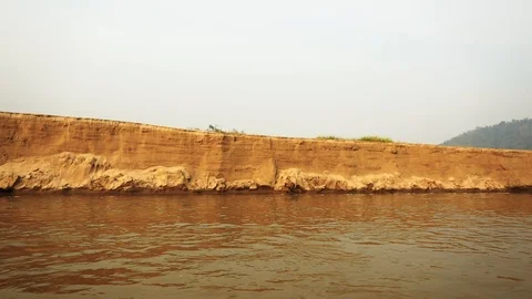 Erosion of river bank,Large sandy beach,  river Bank with the erosion of soil Stock Footage 117445877