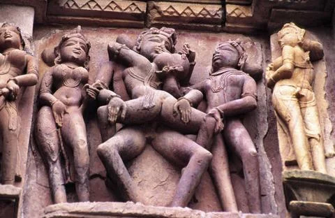 Erotic relief in the temple Devi Jagadambi(s.X-XI). Khajuraho.Madhya Prade... Stock Photos