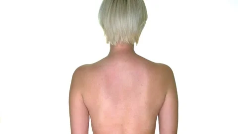 Erotic young blonde model throws her bra over her shoulder. Sexy back. Video stock 116411775