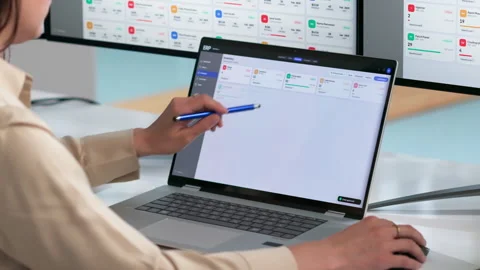 ERP Consultant Analyzes Enterprise Software Solutions On Laptop Stock Footage 338171838