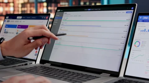 ERP Consultant Reviews Cloud Software Solutions On Laptop Stock Footage 332905085
