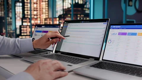 ERP Consultant Reviews Cloud Software Solutions On Laptop Stock Footage 333398793