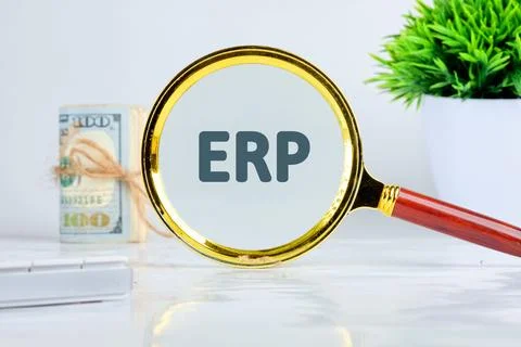 ERP - Enterprise resource planning theme. Concept word ERP through a magnif.. Foto stock