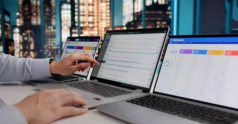 ERP Specialist Evaluates Cloud-Based Business Software On Laptop At Night Stock Photos