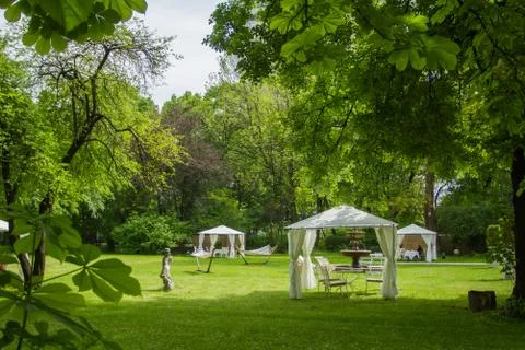 Errace restaurant in the park, with a table setting. Stock Photos