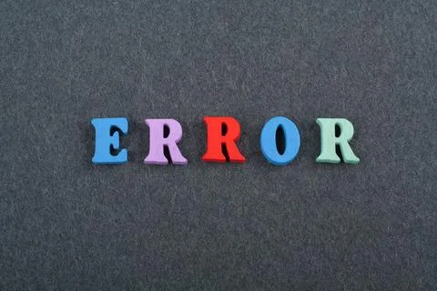 ERROR word on black board background composed from colorful abc alphabet bl.. Stock Photos