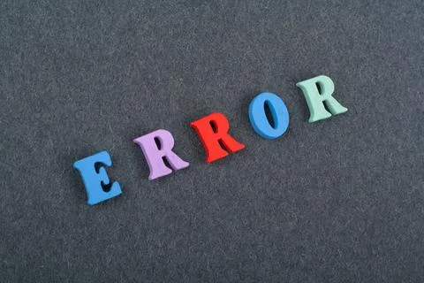 ERROR word on black board background composed from colorful abc alphabet bl.. Stock Photos