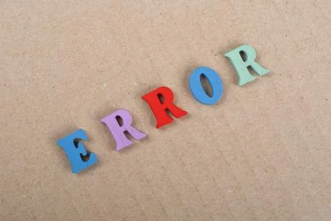 ERROR word on paper background composed from colorful abc alphabet block wo.. Stock Photos