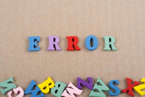 ERROR word on paper background composed from colorful abc alphabet block wo.. Stock Photos