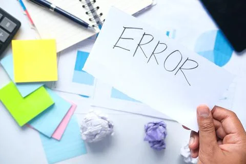 Error word on paper with notepad and chart on table , 写真素材