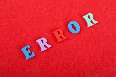 ERROR word on red background composed from colorful abc alphabet block wood.. Stock Photos
